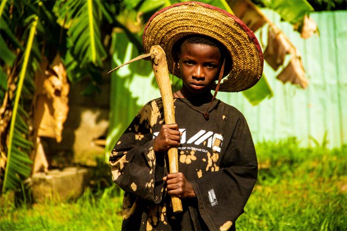 Boy Holding  Hoe